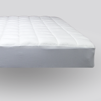 nacreous mattress pad on bed